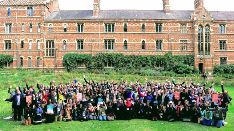 Group photo of participants to the conference, with Keble College in the background