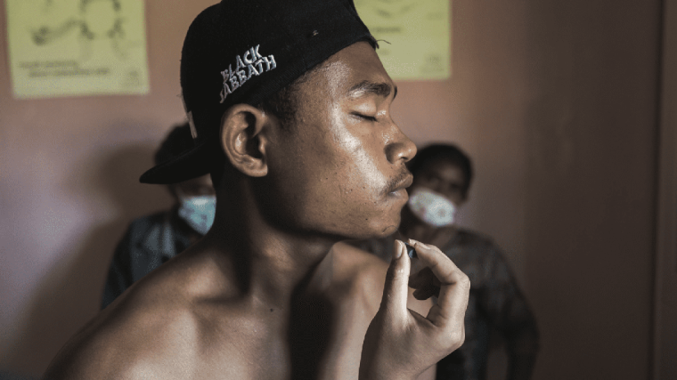 Man with leprosy in Sumba, Indonesia, receiving a multi-drug therapy to treat his conditions