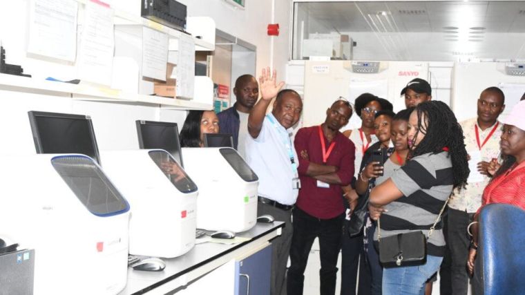 Participants to KWTRP Media Engagement visiting a lab