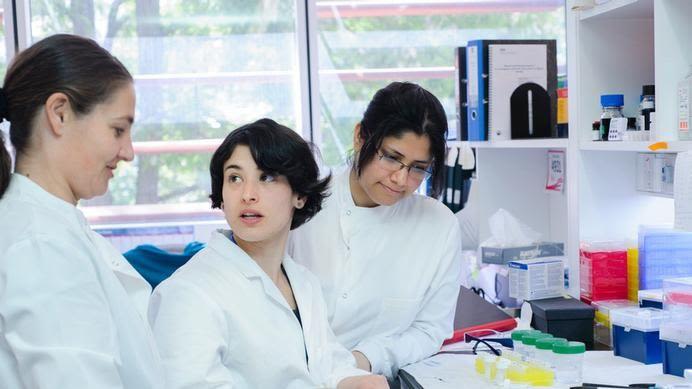 Three female scientists in a lab