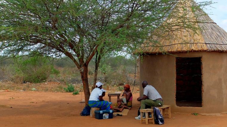 Local people talking under a tree in Africa