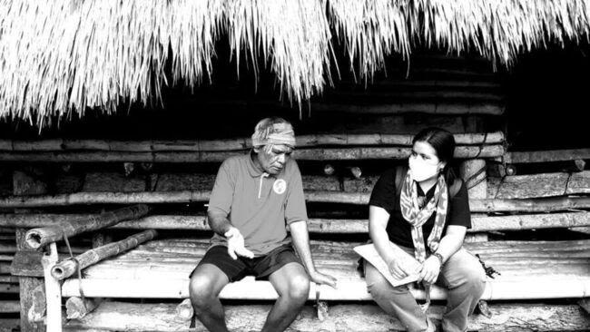 Researcher listening to a local resident of Sumba, Indonesia