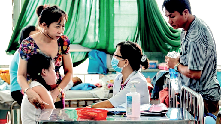 Healthcare workers and patients in a hospital in Southeast Asia