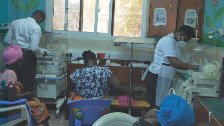 Healthcare workers in a busy neonatal ward in Kenya