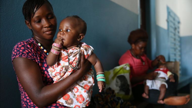 African Mother and child, waiting in a health centre
