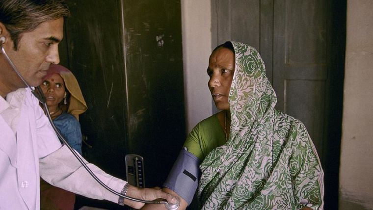 Female patient get a check up in a healthcentre in India