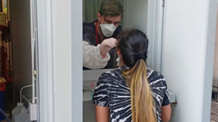 Healthcare worker conducting a COVID test at the Hospital for Tropical Diseases in Bangkok