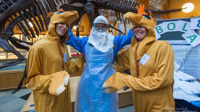 3 people dressing costumes in the Museum of Natural Sciences
