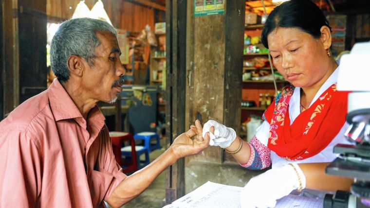 Nurse testing a patient in Southeast Asia